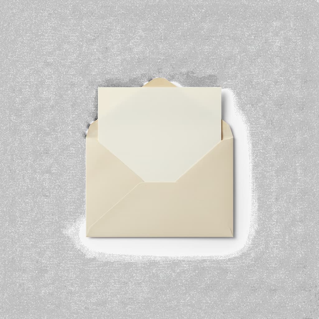 An opened cream paper envelope with a folded letter peeking out.